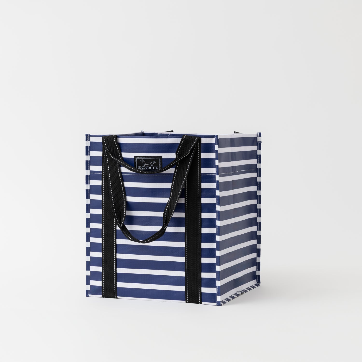Navy and white striped tote bag with black handles on a light gray background