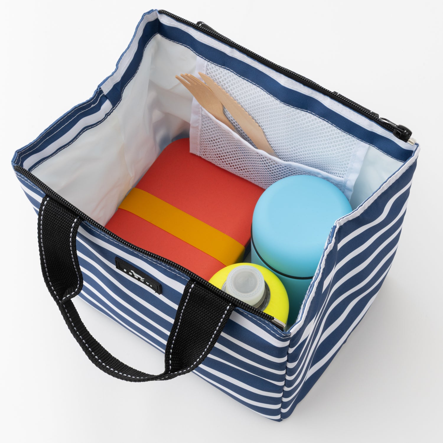 Blue and white striped tote bag with lunch items on a white background