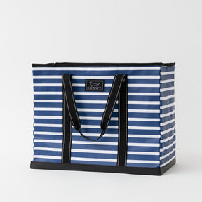 Blue and white striped tote bag with black handles on a light gray background