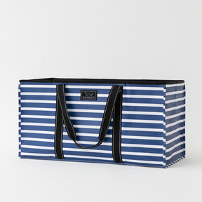 Blue and white striped tote bag with black handles on a light gray background