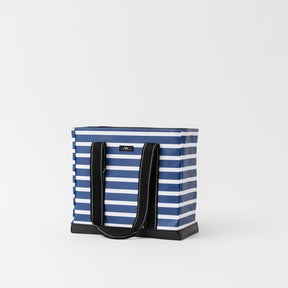 Blue and white striped tote bag with black handles on a light gray background