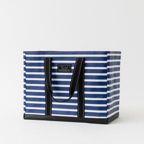 Navy and white striped tote bag with black handles on a light gray background