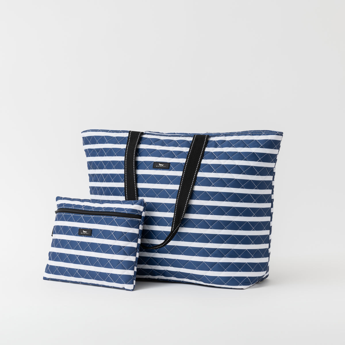 Two blue and white striped bags on a light gray background