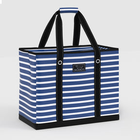 Blue and white striped tote bag with black handles on a light gray background