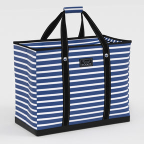 Blue and white striped tote bag with black handles on a light gray background