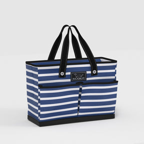 Blue and white striped tote bag with black handles on a light gray background