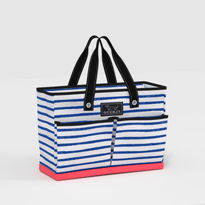 Striped tote bag with black handles and pink base on a light gray background