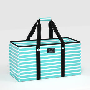 Teal and white striped tote bag with black handles on a light gray background