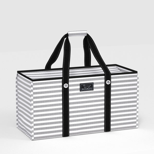 Striped bag with black handles on a light gray background