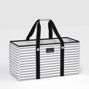 Striped bag with black handles on a light gray background