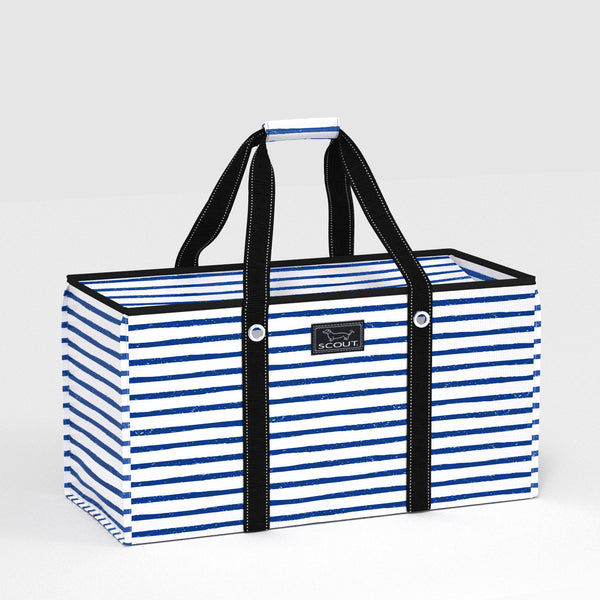 Blue and white striped tote bag with black handles on a light gray background