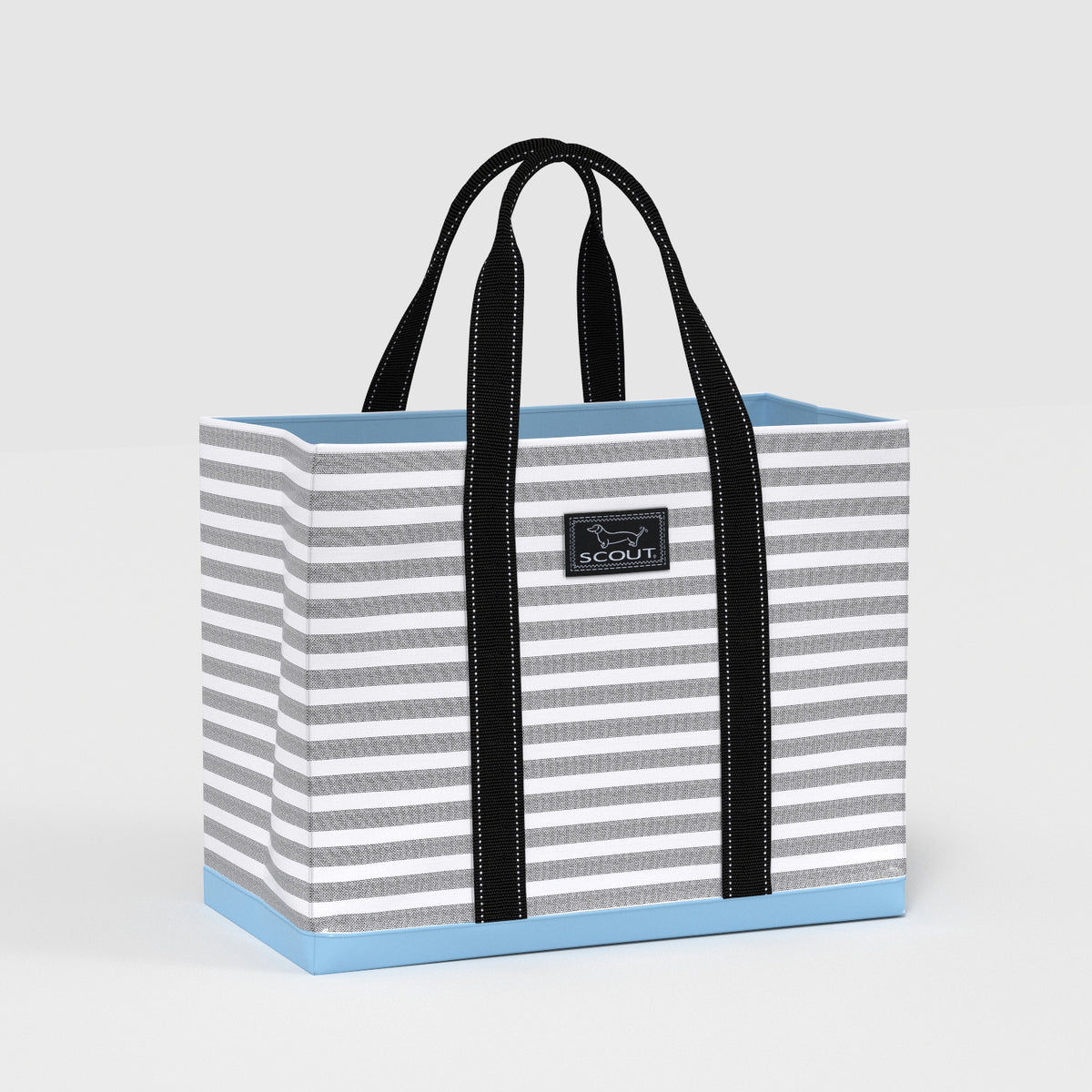 Striped tote bag with black handles on a light gray background
