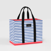Striped tote bag with black handles on a light gray background