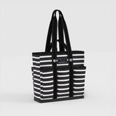 Black and white striped tote bag with 'SCOUT' logo on a light gray background