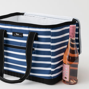 Blue and white striped cooler bag with a bottle of pink wine on a light gray background
