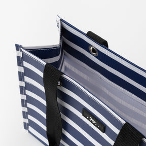Blue and white striped bag with black handles on a white background