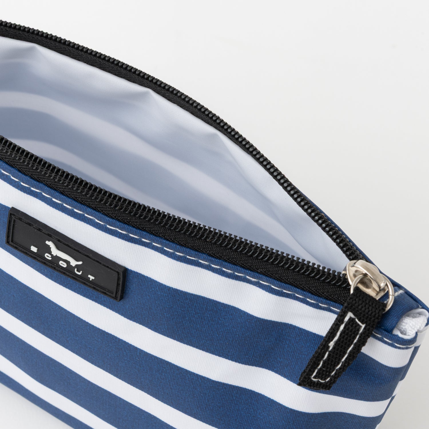 Blue and white striped bag with a visible brand logo on a light gray background